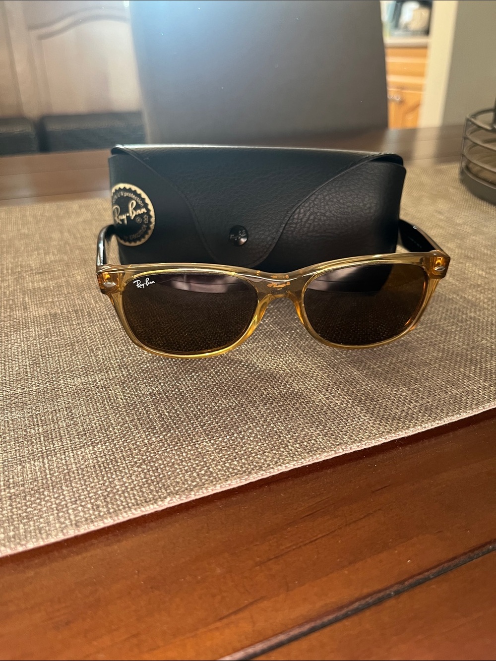 Ray-Ban Women’s Amber Transparent Frame Sunglasses with Dark Lenses